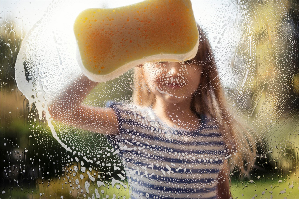 Girl Cleaning Window -