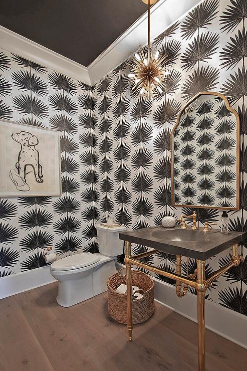 Powder room with dramatic black painted ceiling and white molding