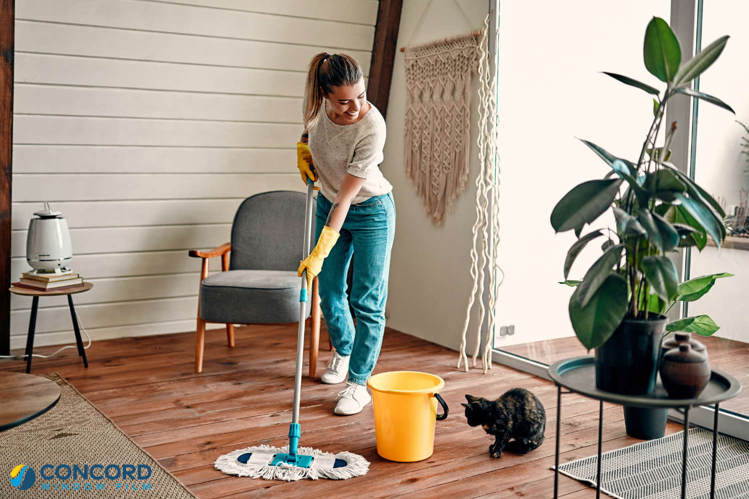 A woman cleaning her floors for a blog post on the top 5 must-do spring cleaning jobs