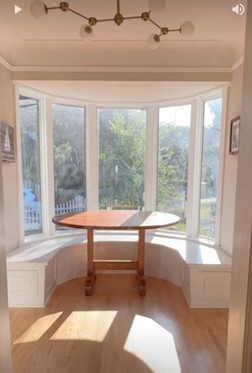 Picture of a sunny dining room nook for a window film before and after transformation case study