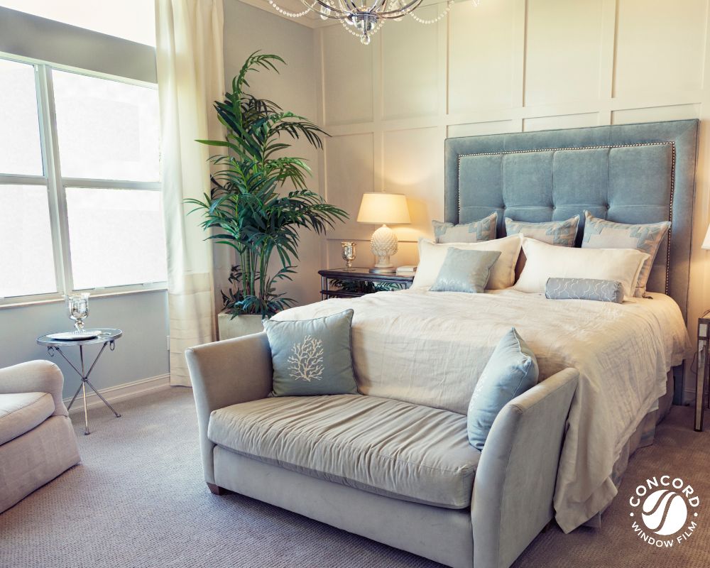 Bedroom with matte white privacy film on the windows