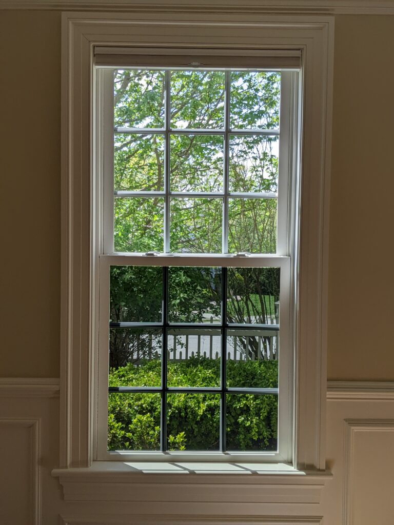 Photo Of A Double Hung Window With Comfortech 25 Installed On The Bottom Sash And Nothing On The Top Sash For A Blog Entitled Window Film Installed