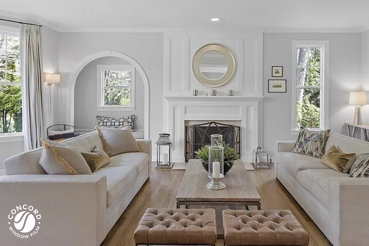Photo of a beautiful living room with hardwood floors and decor for a Concord Window Film blog post entitled Protect Your Home from UV Damage