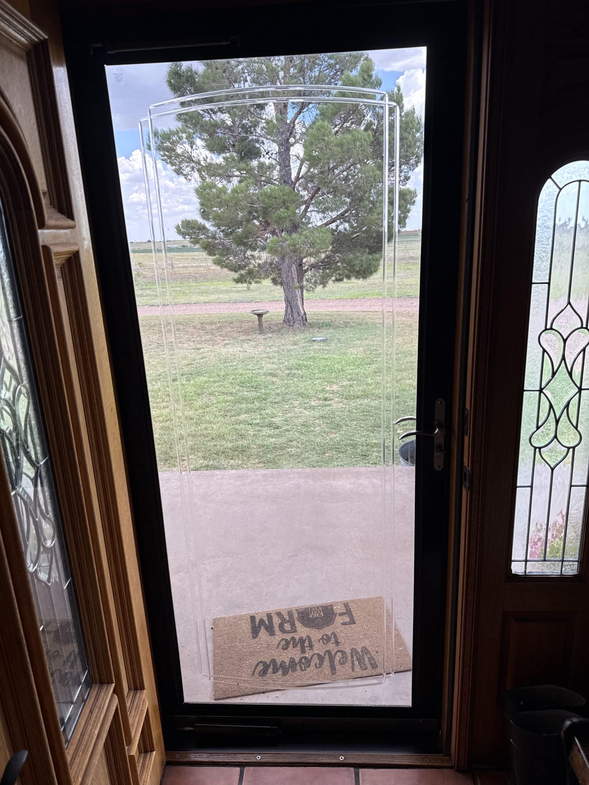 Photo Of Comfortech 45 Storm Door Window Film Kit Installed On A Storm Door