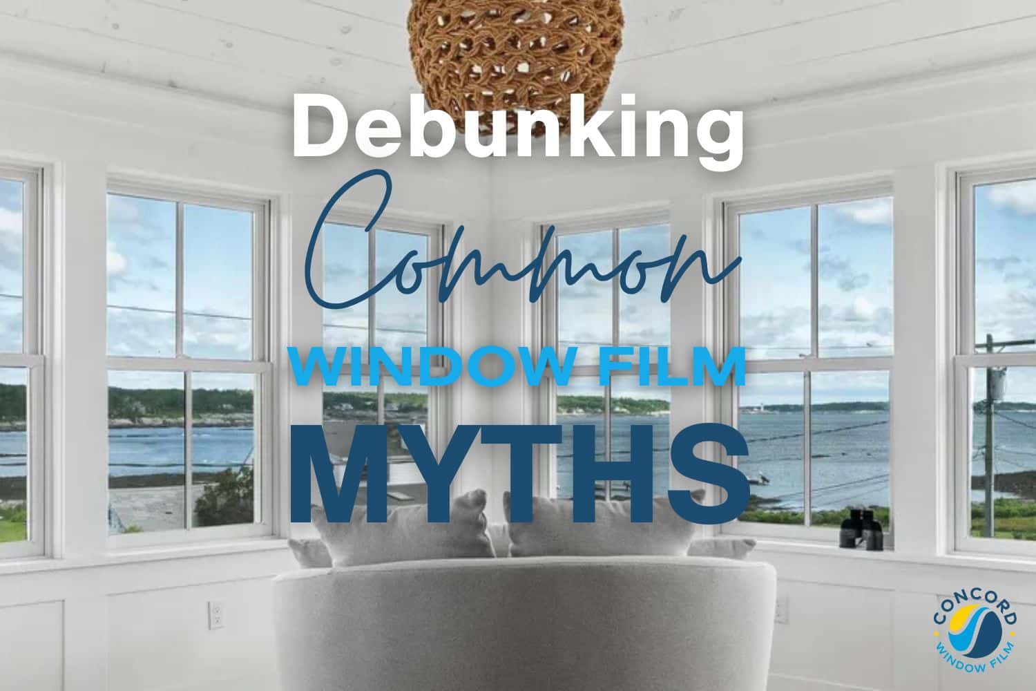 Photo of a bank if windows in a house overlooking the ocean for a post on common window film myths