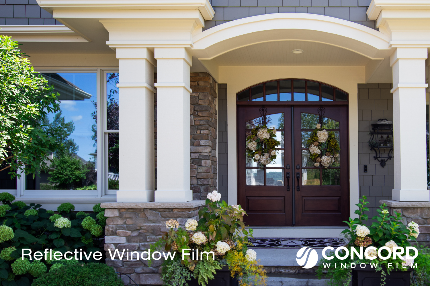 Front of a house with reflective window film on its entry door and window for a blog post entitled reflective window film for home